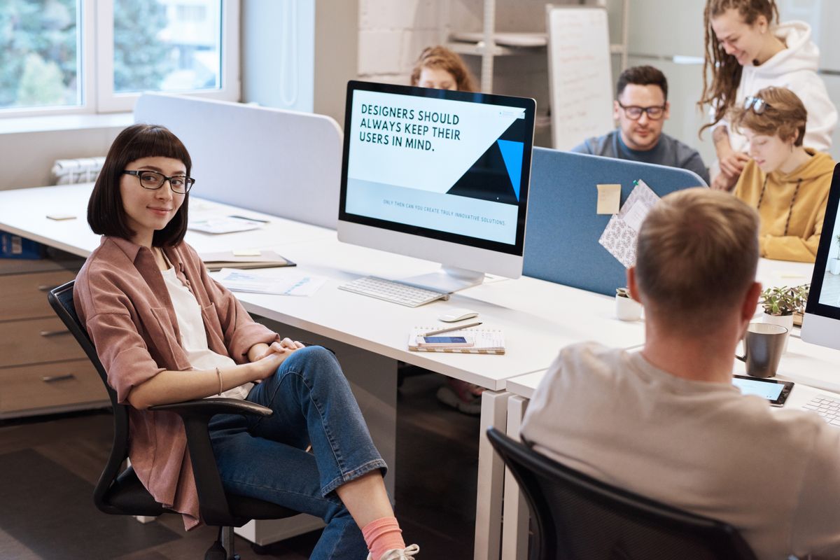 Colleagues working side by side at a desk